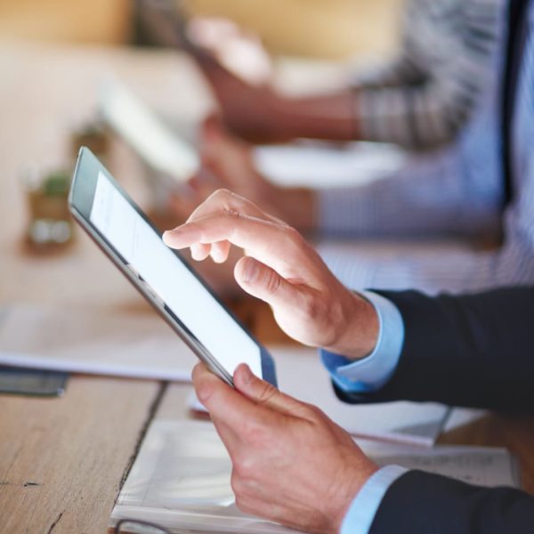 closeup-shot-of-businesspeople-using-digital-table-2026-01-09-09-54-05-utc